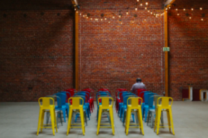 colourful chairs and one person sitting there